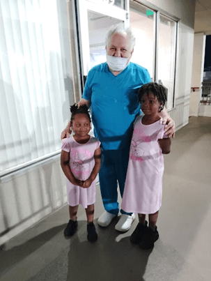Dentist with happy child patients